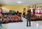 TANAMKAN JIWA DISIPLIN DAN BELA NEGARA, PRAJURIT SATGAS PAMTAS YONKAV 3/AC JAJARAN POS KOKI SSK II PIMPIN KEGIATAN SAKA WIRA KARTIKA DI SMPN 1 PURING KENCANA